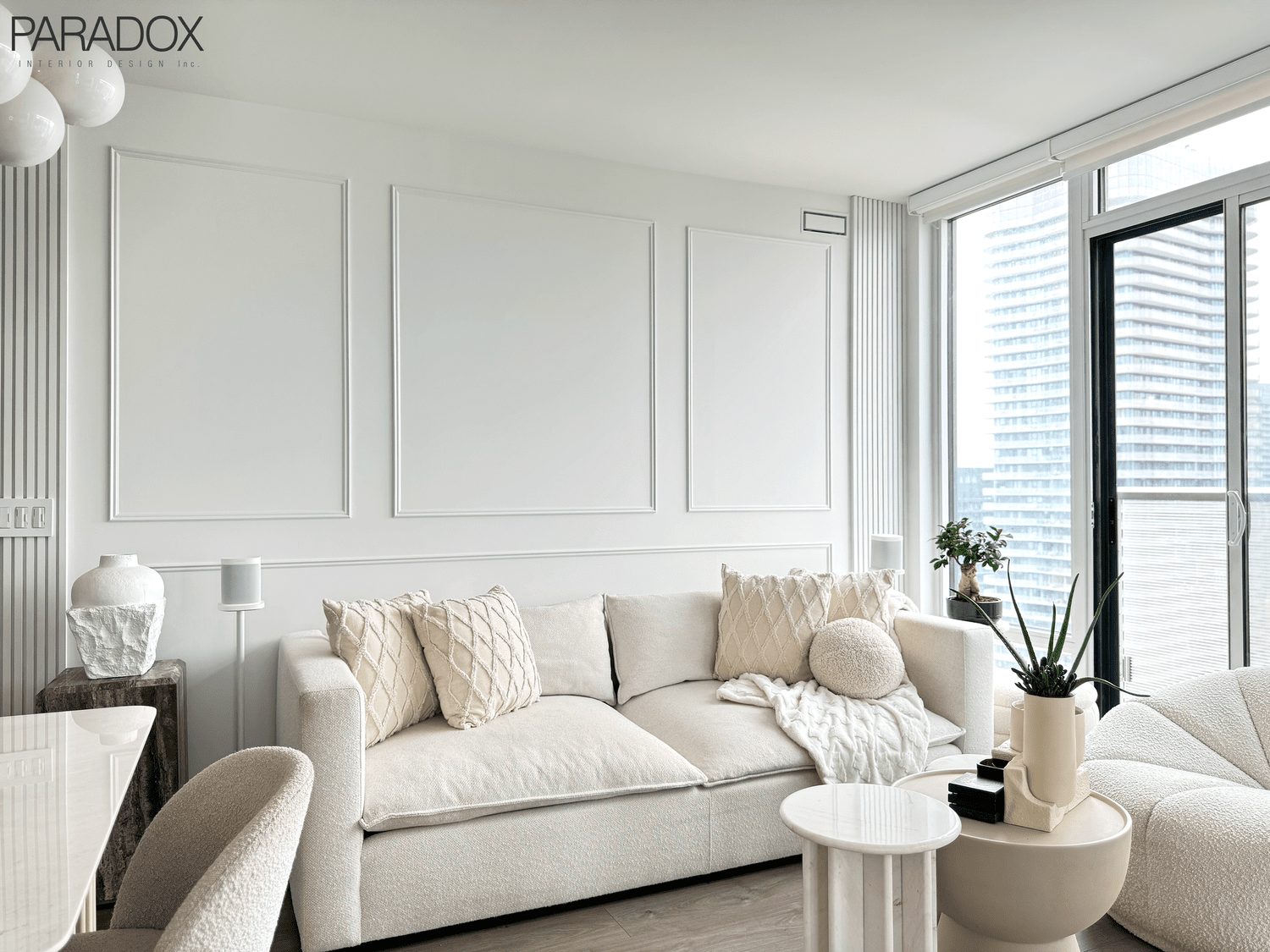 Calm downtown Toronto condo living space in light tones with layered textures