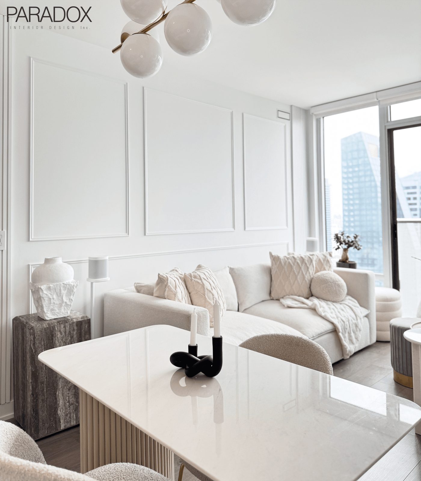 Calm downtown Toronto condo living space in light tones with layered textures, view 2