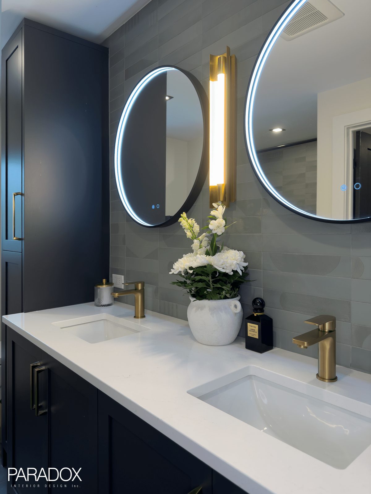 Guest bathroom in an Ontario lake house with green wall tile, dark grey floor tile and a custom double vanity, view 2