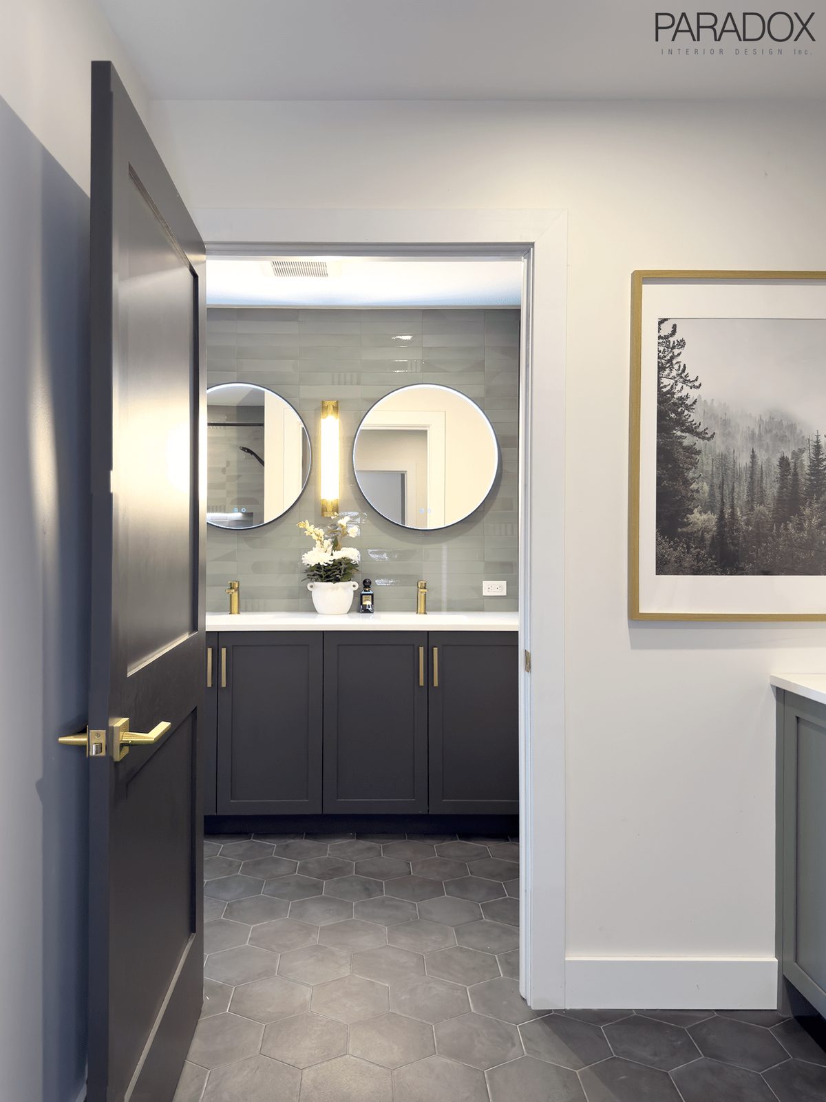 Guest bathroom in an Ontario lake house with green wall tile, dark grey floor tile and a custom double vanity, view 3