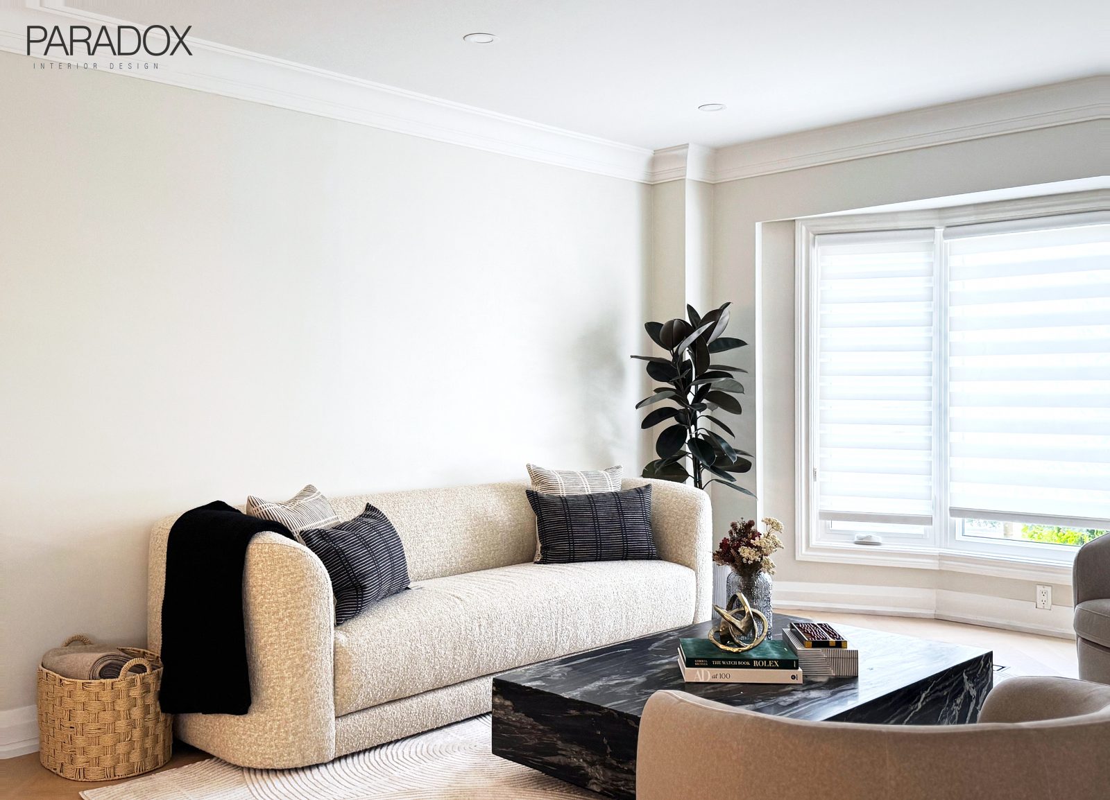 Richmond Hill living and dining room with herringbone hardwood floors, a marble dining table, a black marble coffee table and wall paneling, view 4